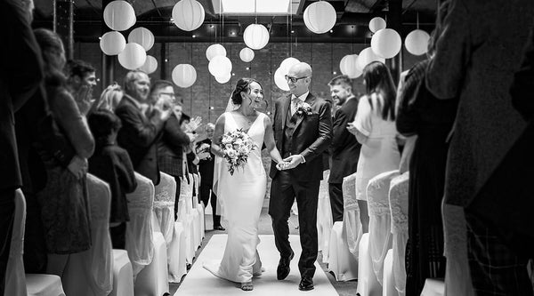 Christina Devine bride and groom walking down the aisle